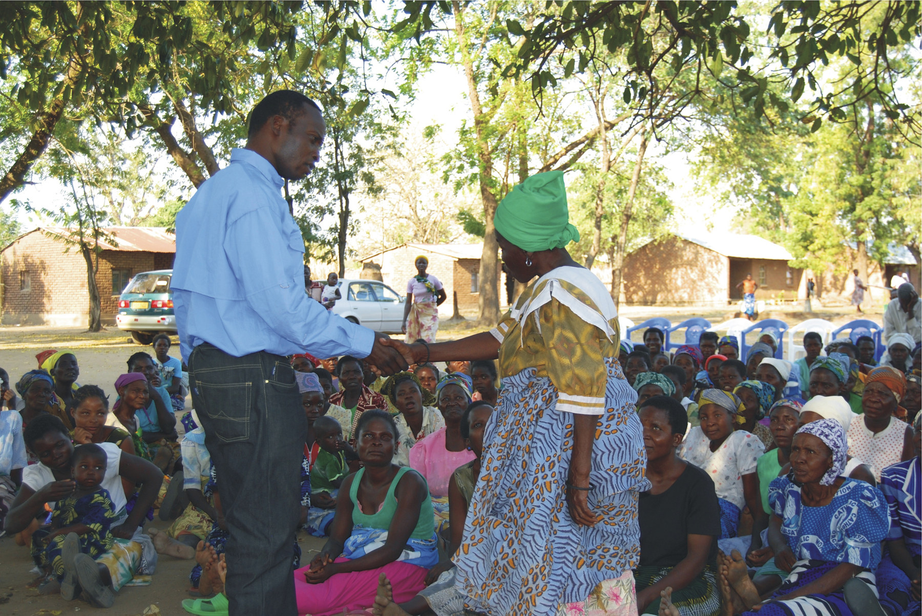 PHOTO CREDIT: Aaron Maluwa of Museums of Malawi relates stories of the danger of HIV to people in the community. Photo courtesy of heartfeltassociates.com
