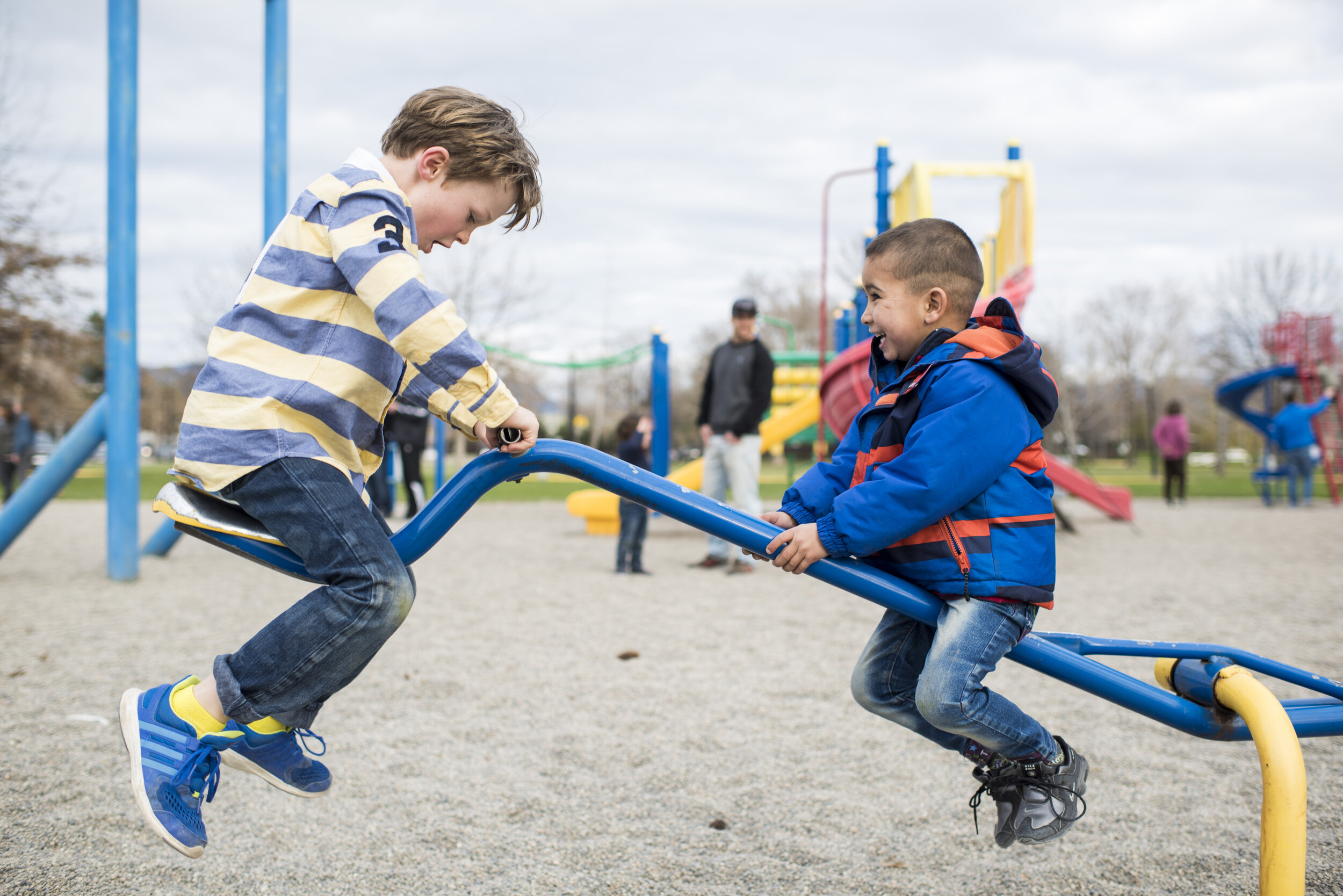 Syrian boy plays with a Canadian boy during an outing to a park, Kelowna, British Columbia, March 24, 2016. The Syrian family came to Canada through private sponsorship.