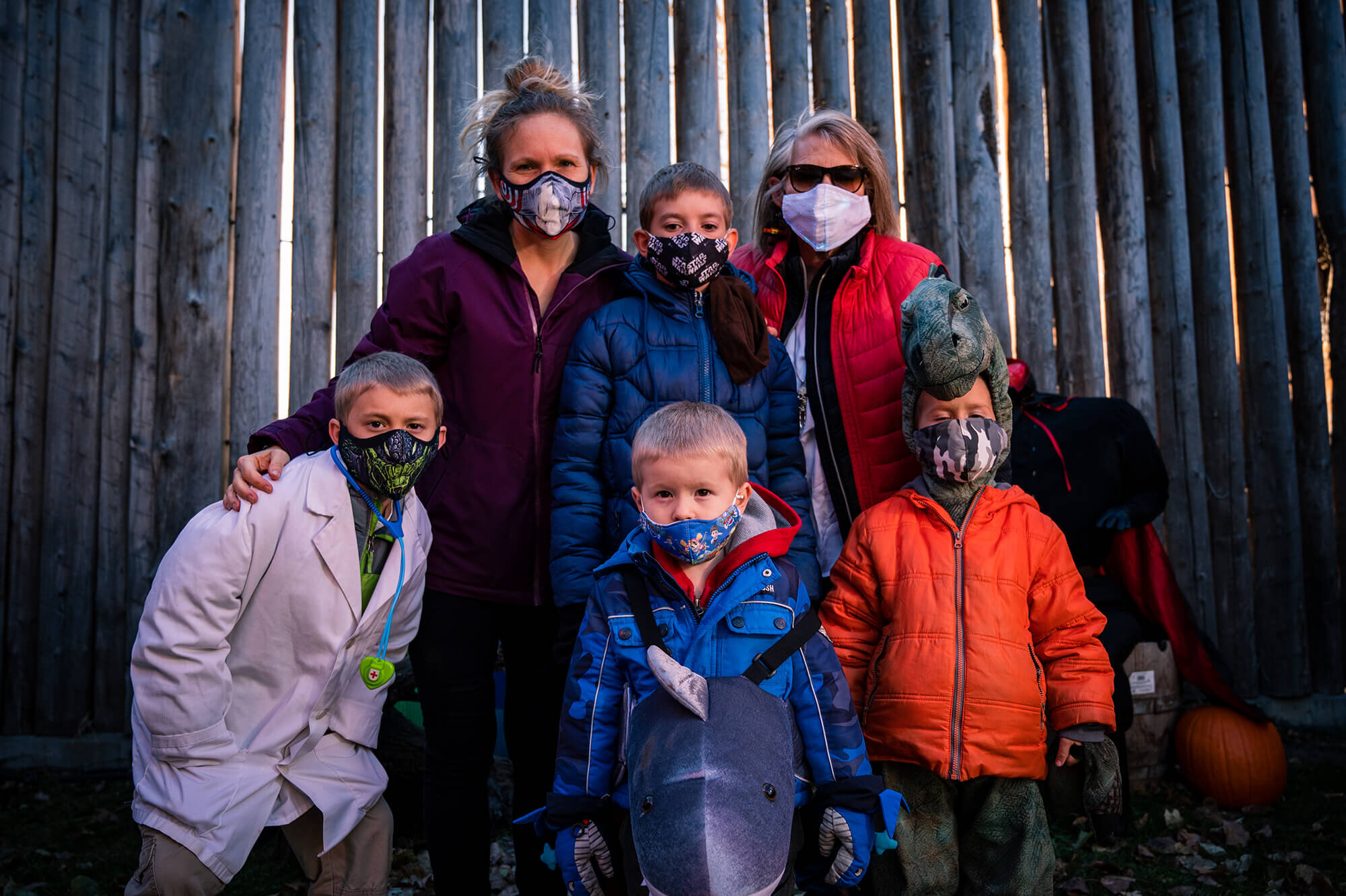 Masked adults and children pose for a picture at the fort’s Hallowe’en Spooktacular.