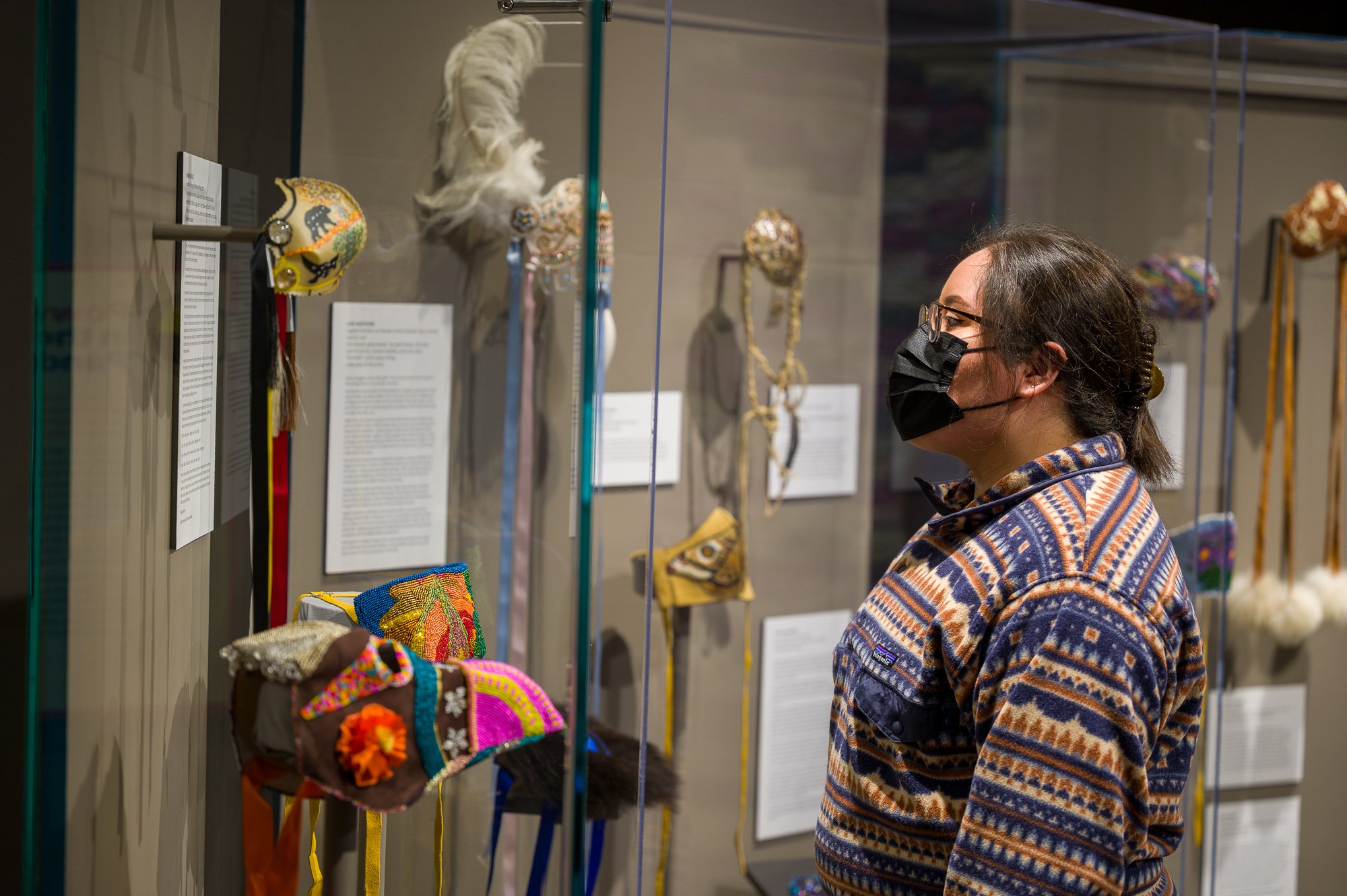  Kalli Eagle Speaker examines the   Breathe. (2nd Wave)  exhibit. Photo by Galt Museum &amp; Archives 