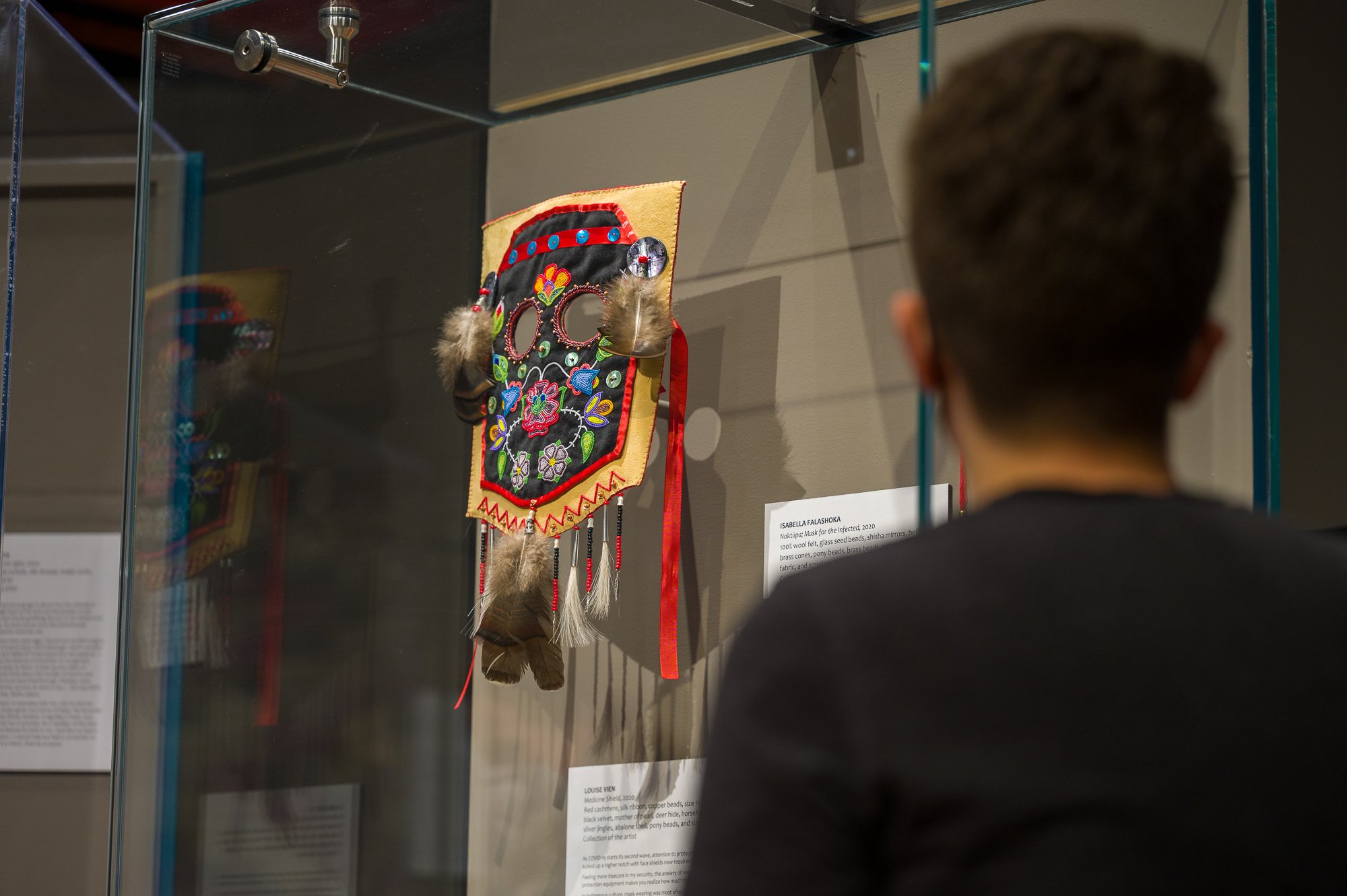  A visitor examines the   Breathe. (2nd Wave)  exhibit. Photo by Galt Museum &amp; Archives 