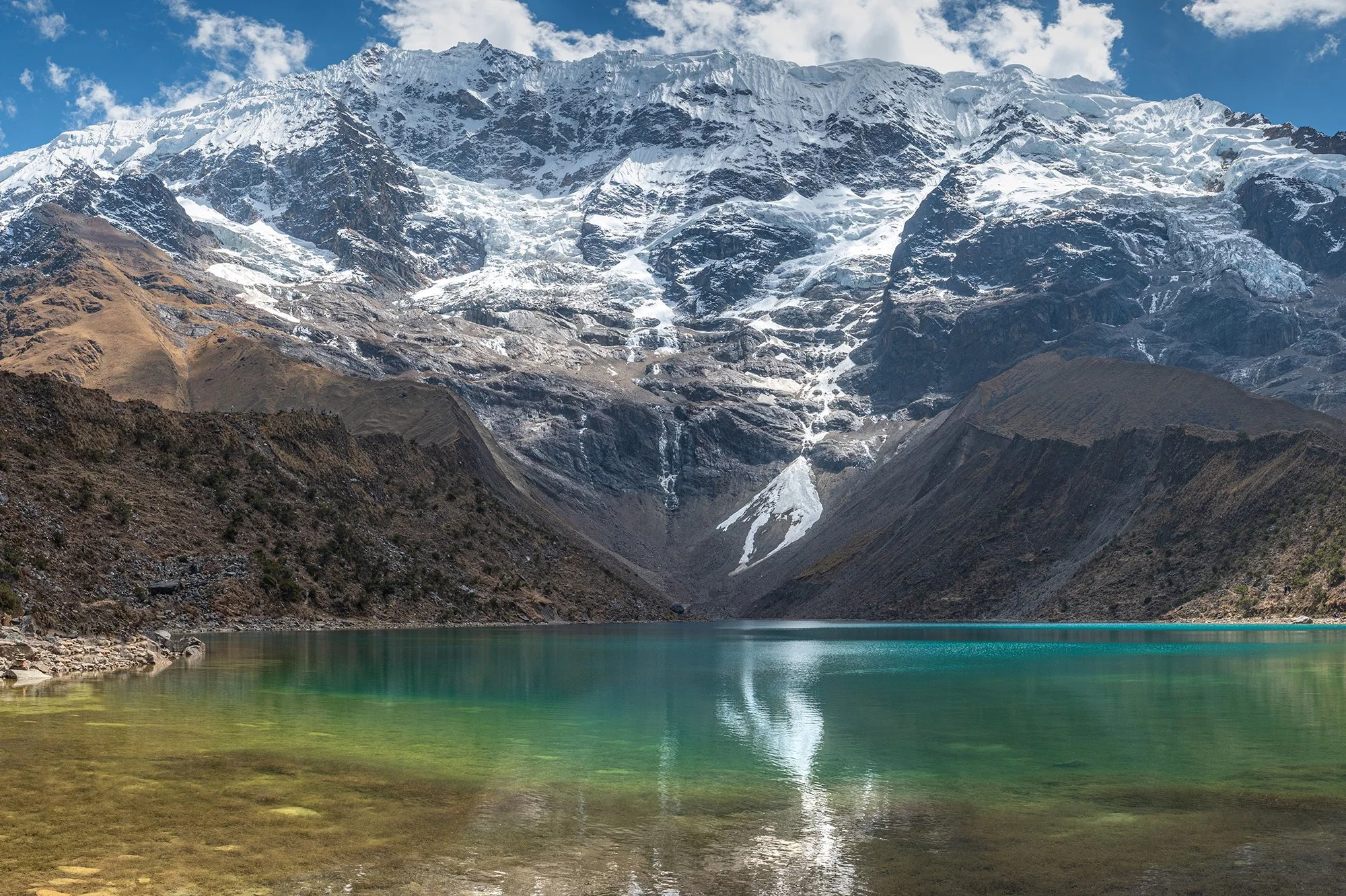 Reaching Humantay Lake in Peru on a journey scripted by &Aacute;vila Experience feels like stepping into a living dream of the Andes. As the trail unfolds, snow-capped peaks rise above turquoise waters, and ancient Inca landscapes reveal their quiet 