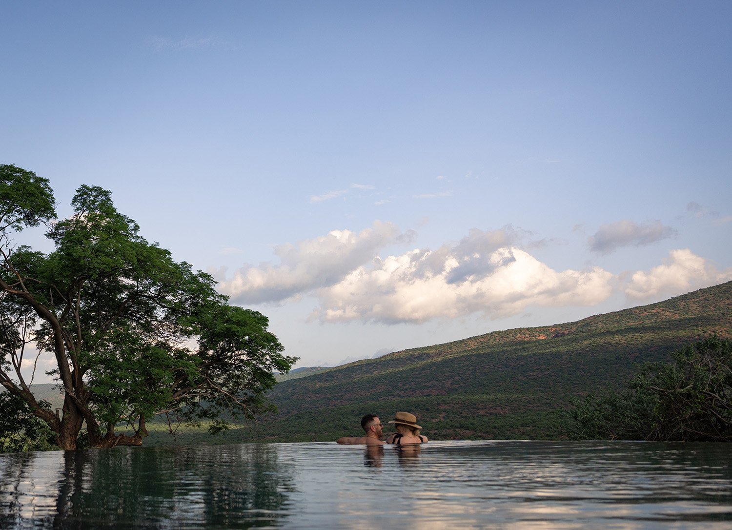 Suspended between sky and wilderness, cool off in the infinity pool at Few &amp; Far Luvhondo, where endless views stretch across the Soutpansberg Mountains. 

@fewandfar.luvhondo