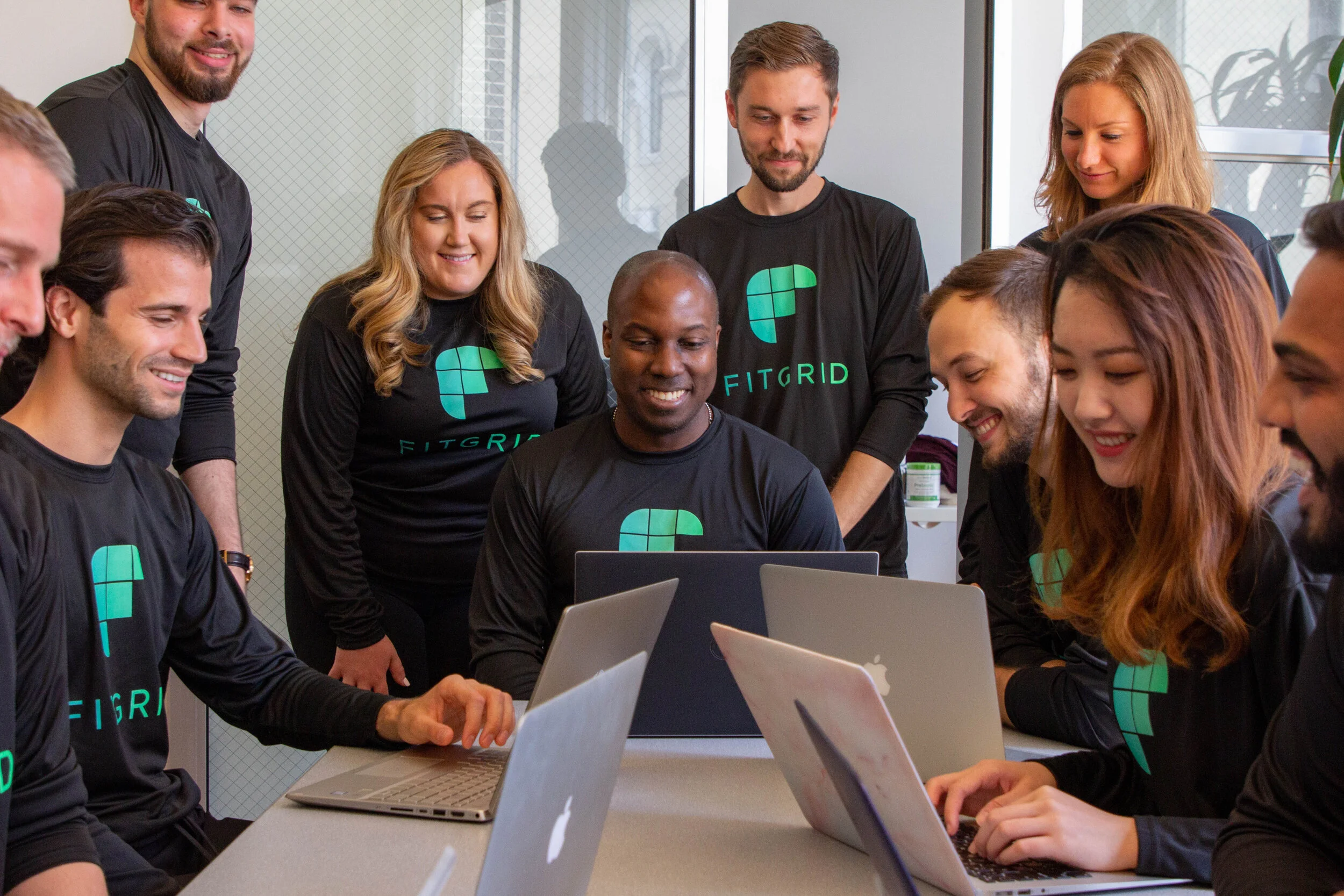 team gathered around nt close up.jpg