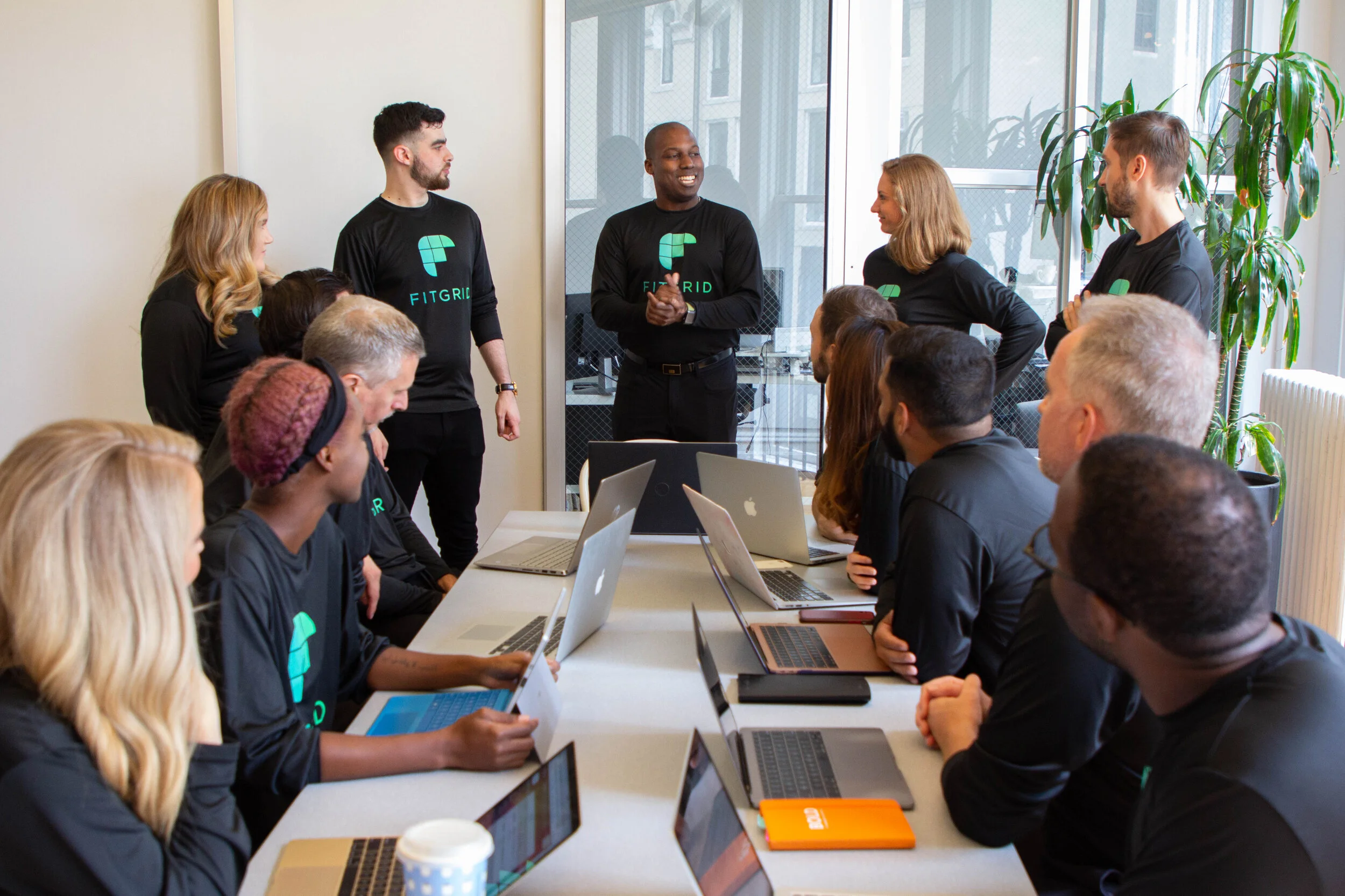team gathered around table.jpg