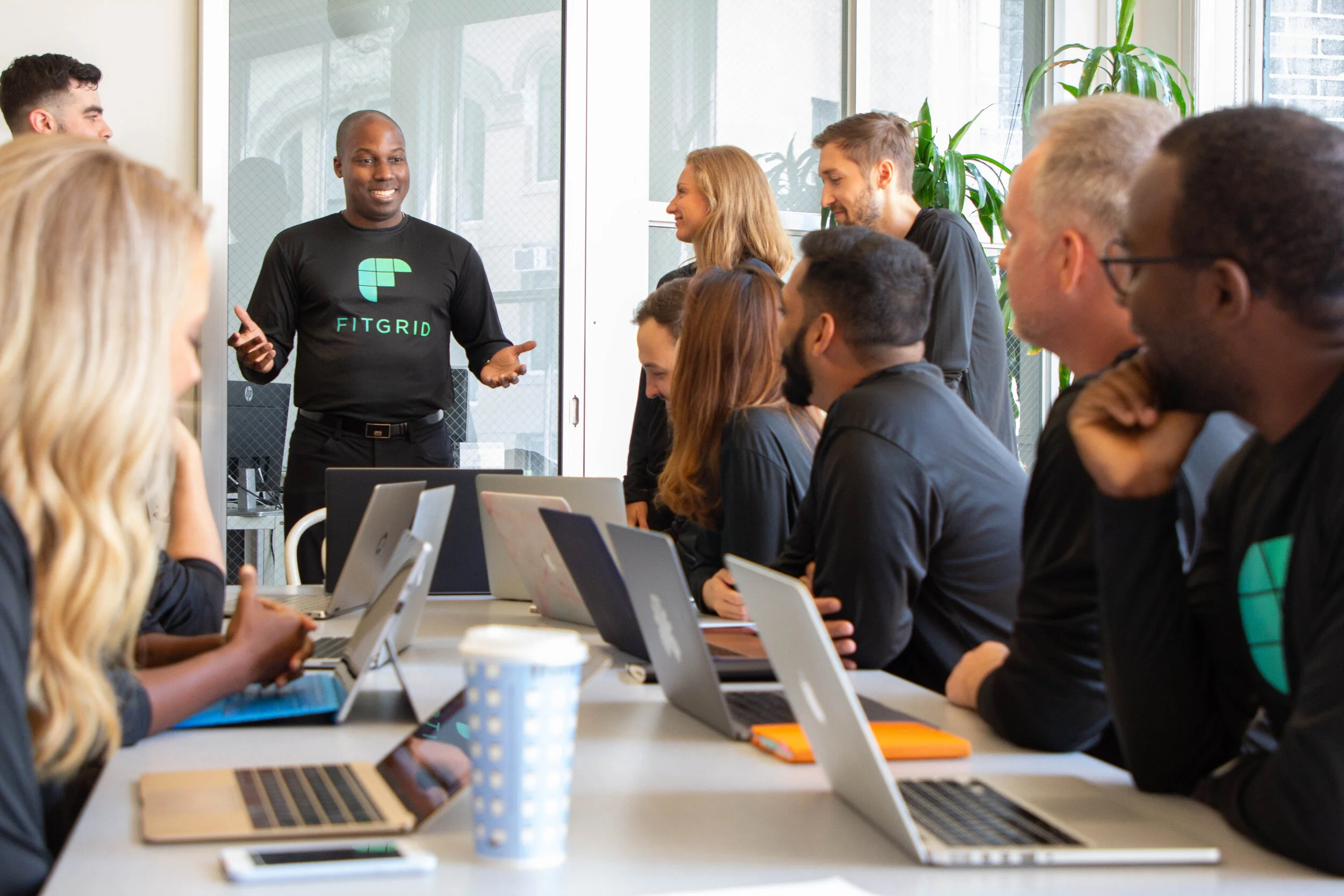 team with laptops nt smiling.jpg