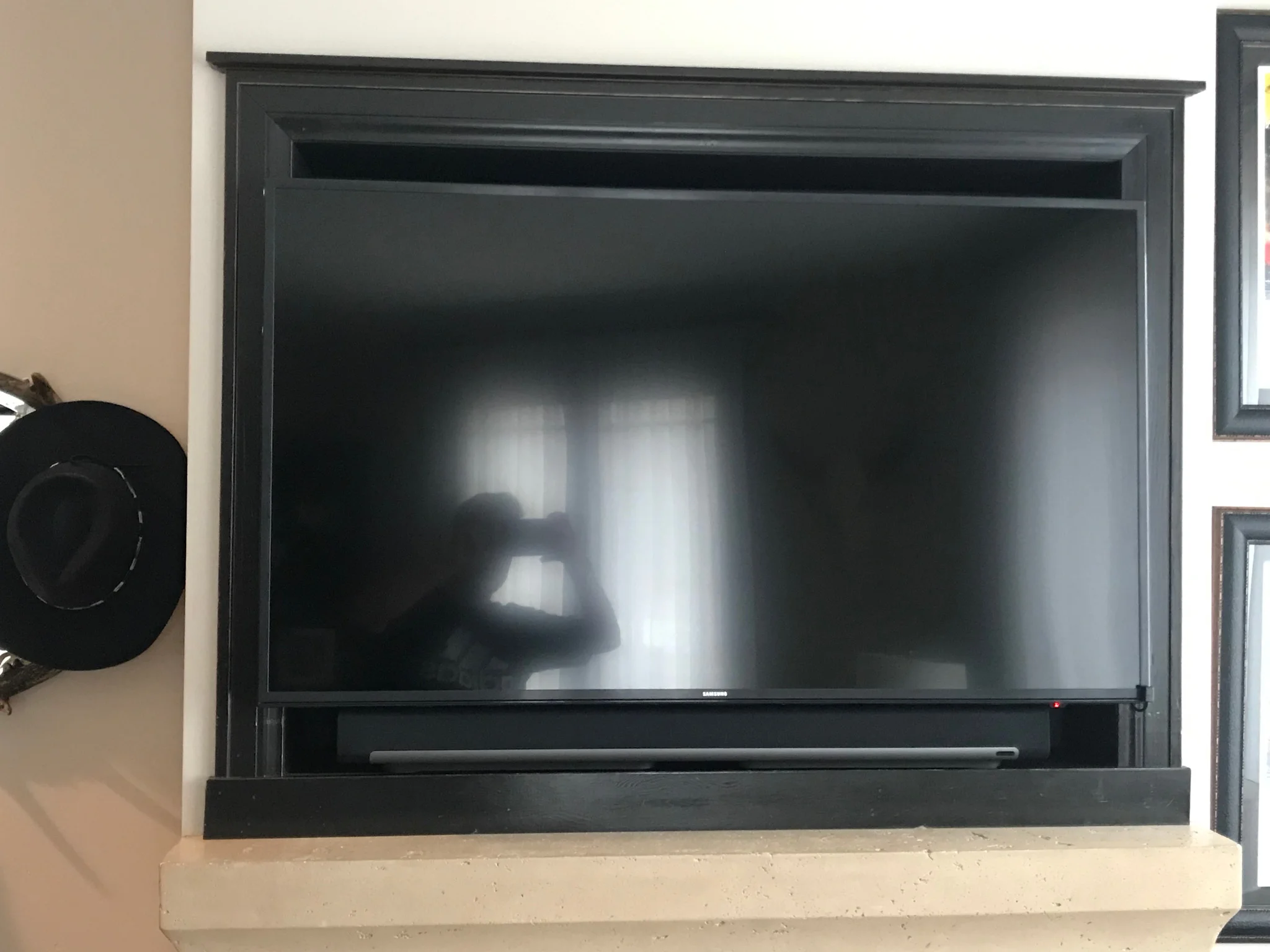  TV mounted and paired with a Sonos sound bar, for a sleek audio/visual system. 