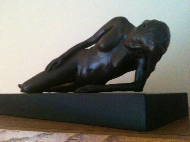 “Young woman in thoughtful repose” 20” x 8” bronze on wood base