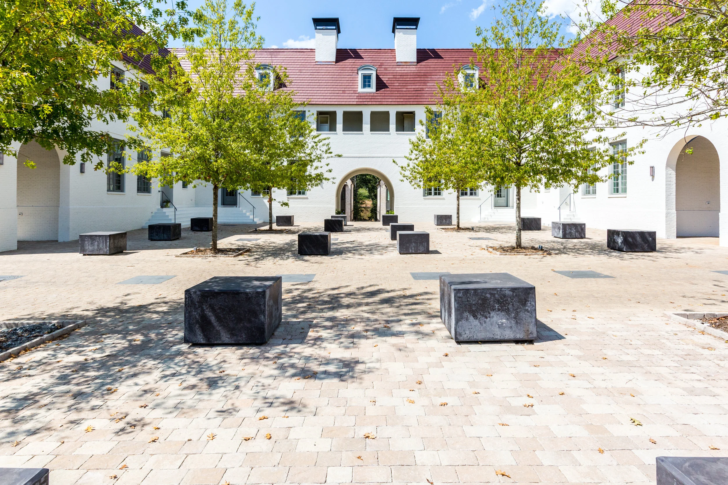Mado’s four Manor Homes are all available and surround concrete cubes that were inspired by the interior courtyard of the Palais Royale in Paris, France. Photo by Richie Gill Photography