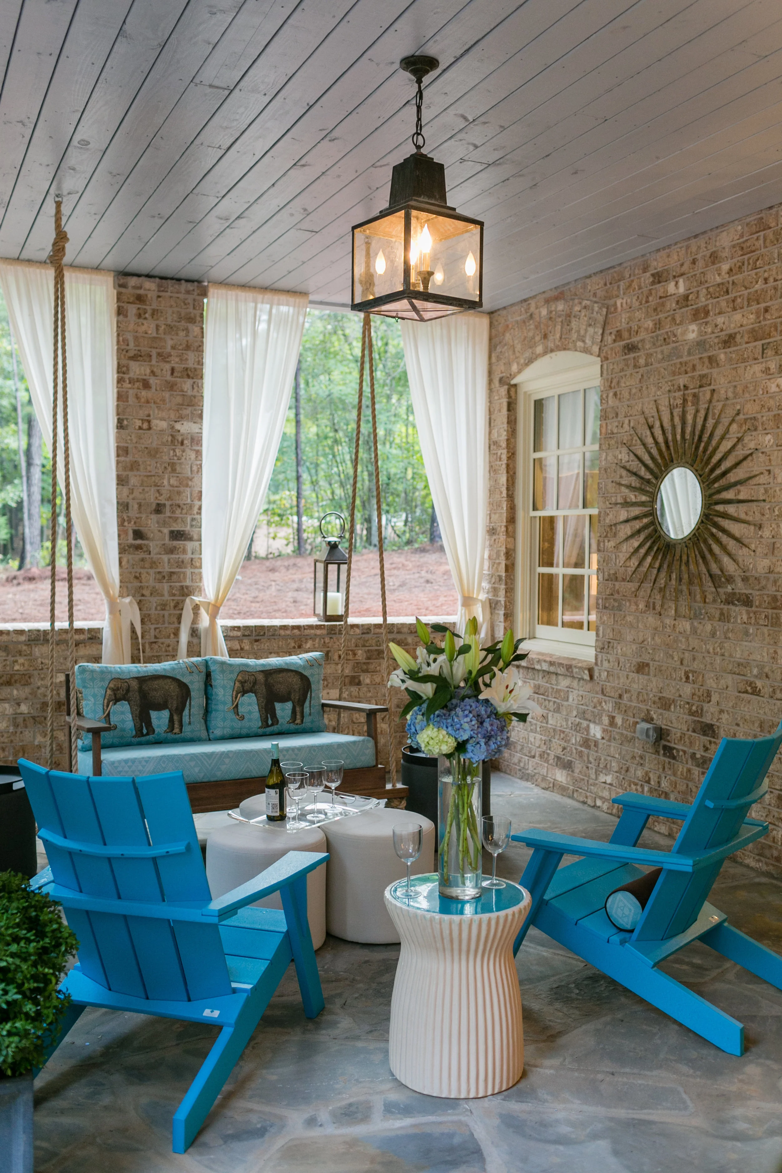 2015 Showhouse Outdoor Terrace by Stuart Pliner Design offered a gorgeous and cozy place to relax while looking out onto woods and Grange Lake. Photo by J. Ashley Photography .