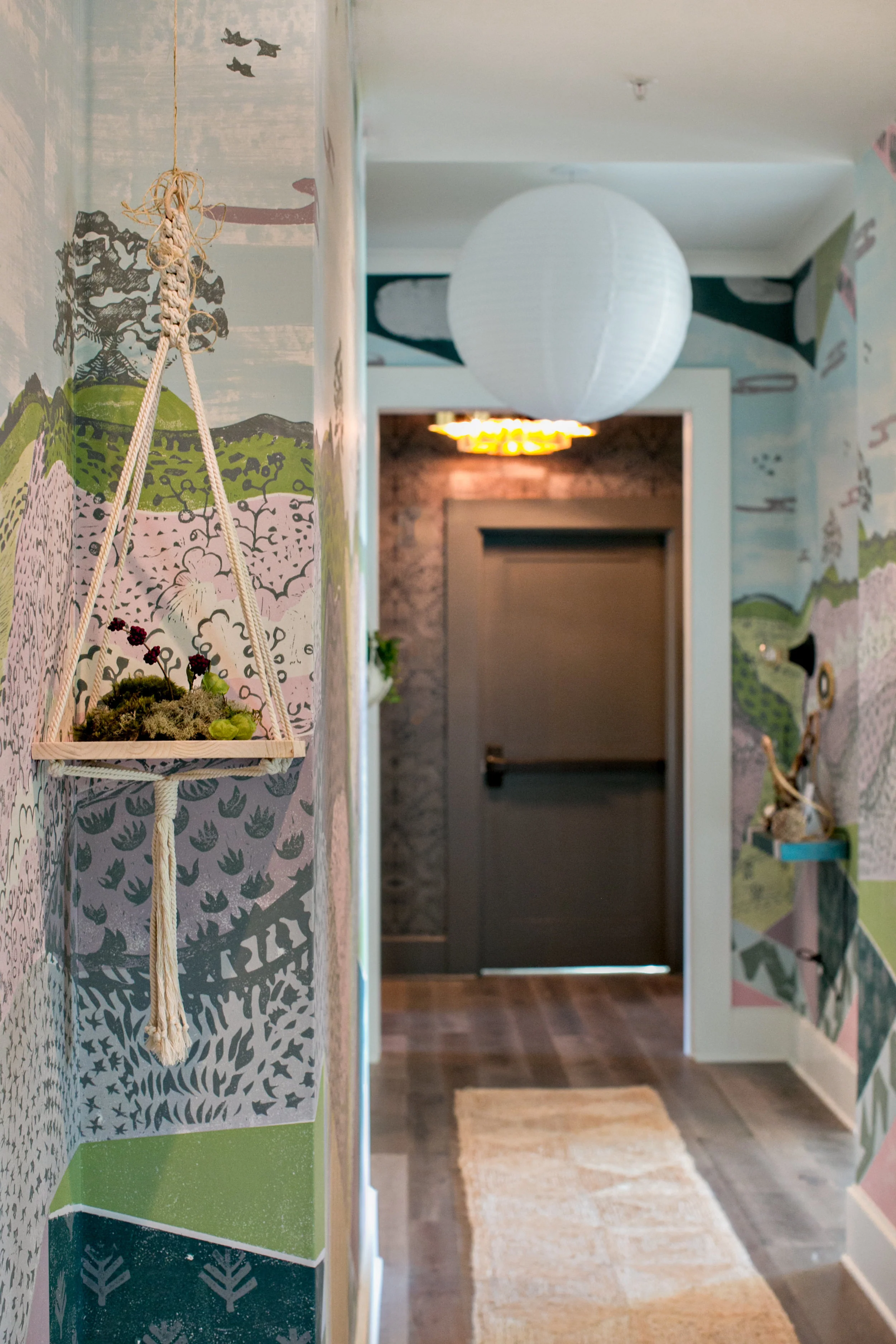 Wallpaper in the 2016 Showhouse hallway, by Tami Ramsey & Krista Nye Schwartz of Cloth & Kind, looked like a painted mural. Photo by J. Ashley Photography .