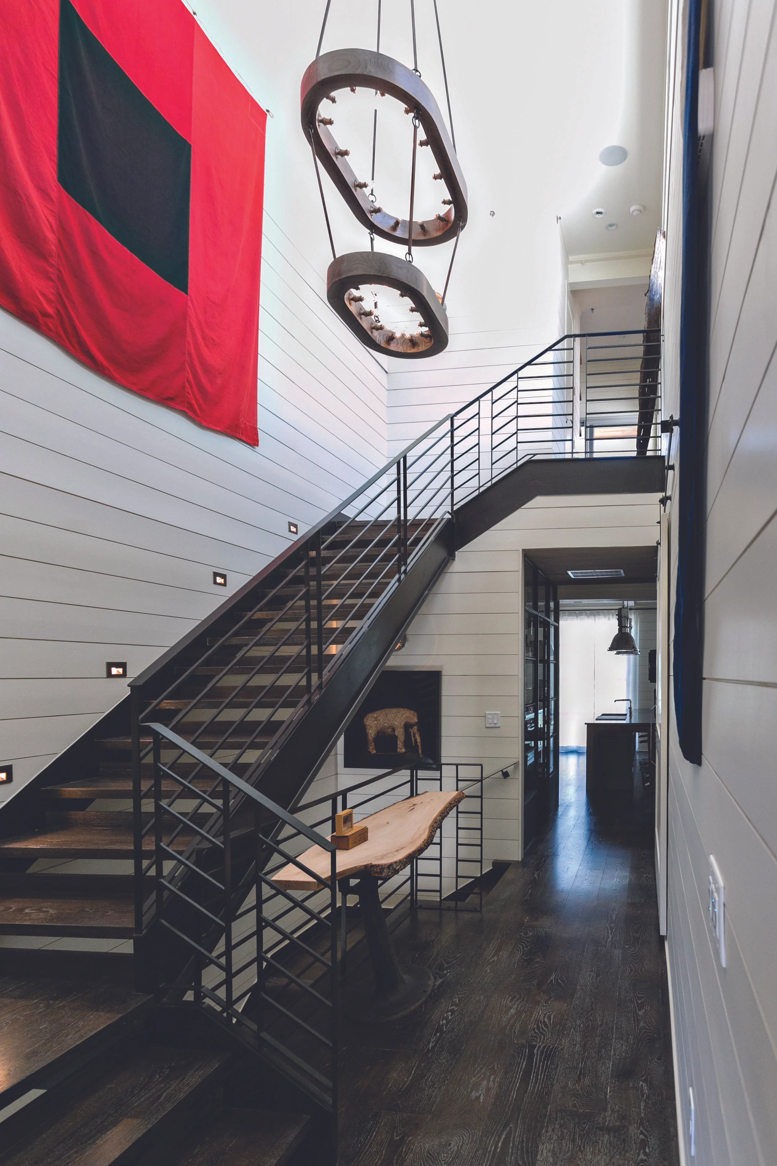 Stairs lead to the rooftop, which has an expansive private patio. Photo by J. Ashley Photography .