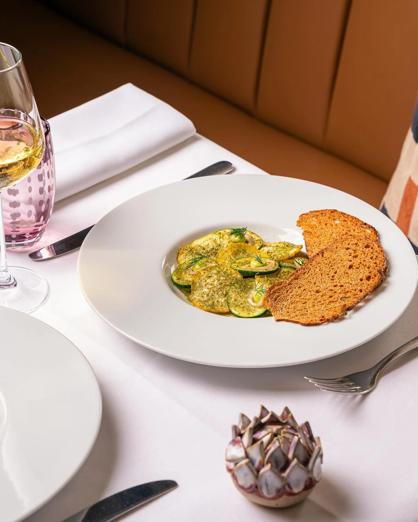 Smoked mackerel and brown crab emulsion with new season gooseberries, salad of raw courgettes in citrus dressing, lovage mayonnaise, campaillou crispbreads