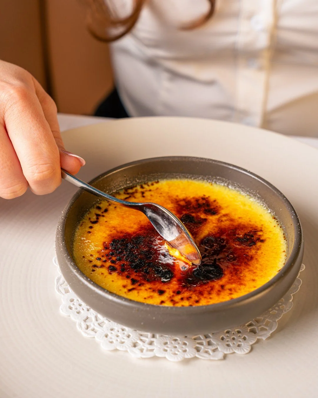 Torched to a deep amber finish, the caramel gives way to a delicately set custard, smooth and lightly infused with vanilla.

It's elegant, restrained, and deeply satisfying. This is a timeless finish to the meal.