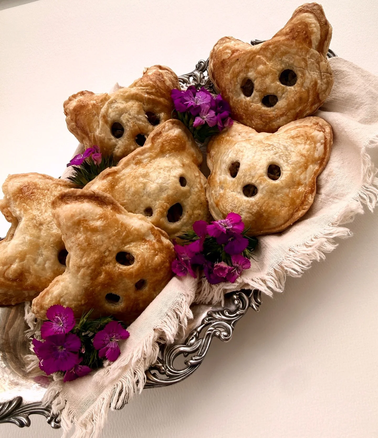 I first saw these little molds and immediately started craving Slavic pirozhki &mdash; the kind I grew up with.
So here they are&hellip; meeting inside a buttery dough, but shaped for kids&rsquo; imagination.

Golden little faces, warm and comforting