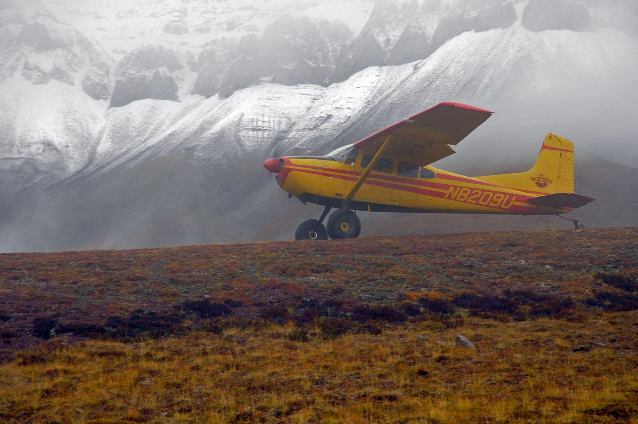 185 at Wolverine airstrip for backcountry backpacking drop-off with snow.jpg