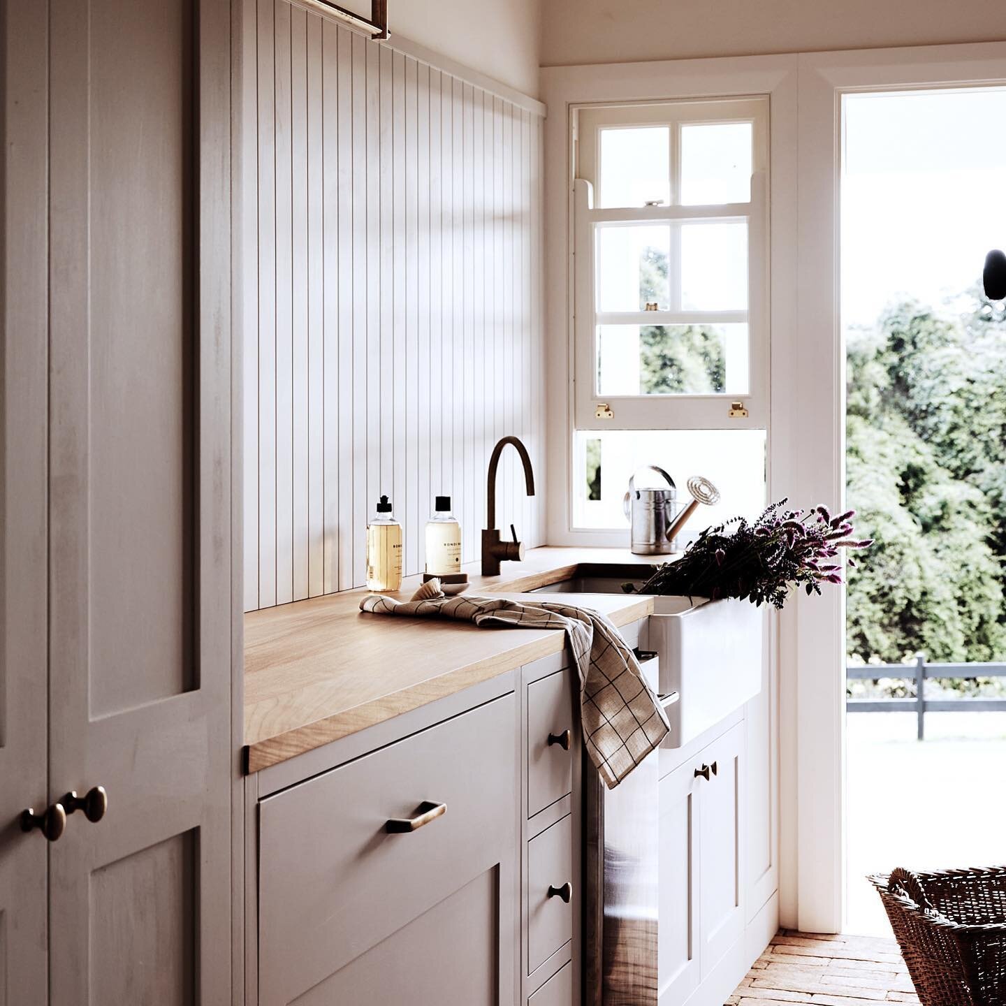 Laundry with a view ..designed with easy access to lawns and verandah. Hidden in the joinery is an ice maker (a party house after all) an extra fridge draw, and three little bits and bobs draws inspired by the boot rooms and scullery&rsquo;s of my ch