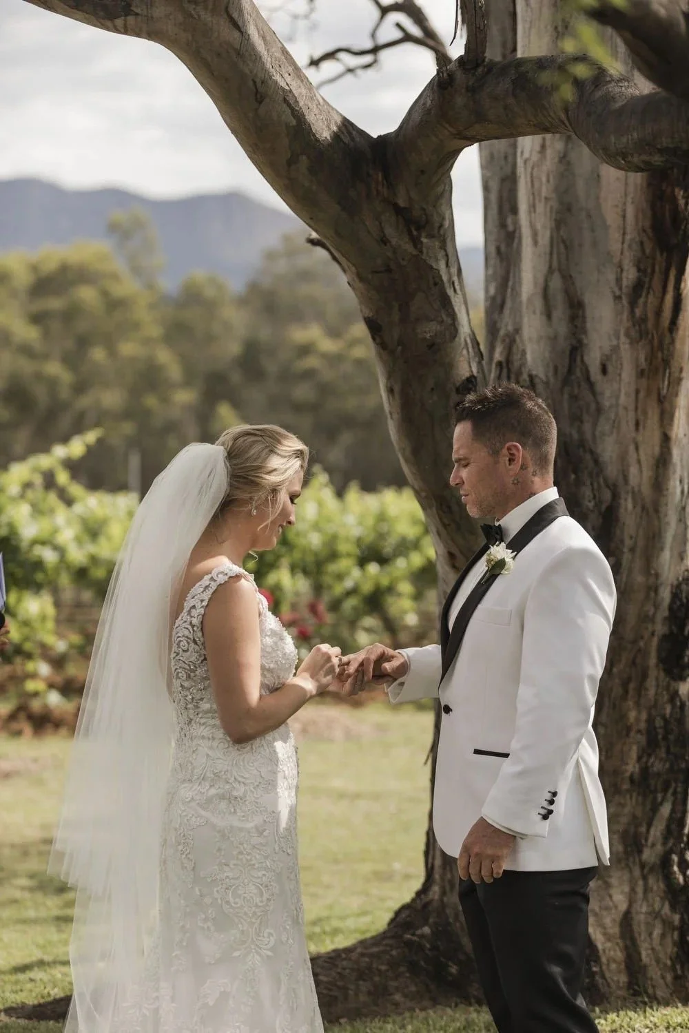 Ring exchange under the gum tree with the range on the horizon, Spicers Vineyards Estate, Pokolbin