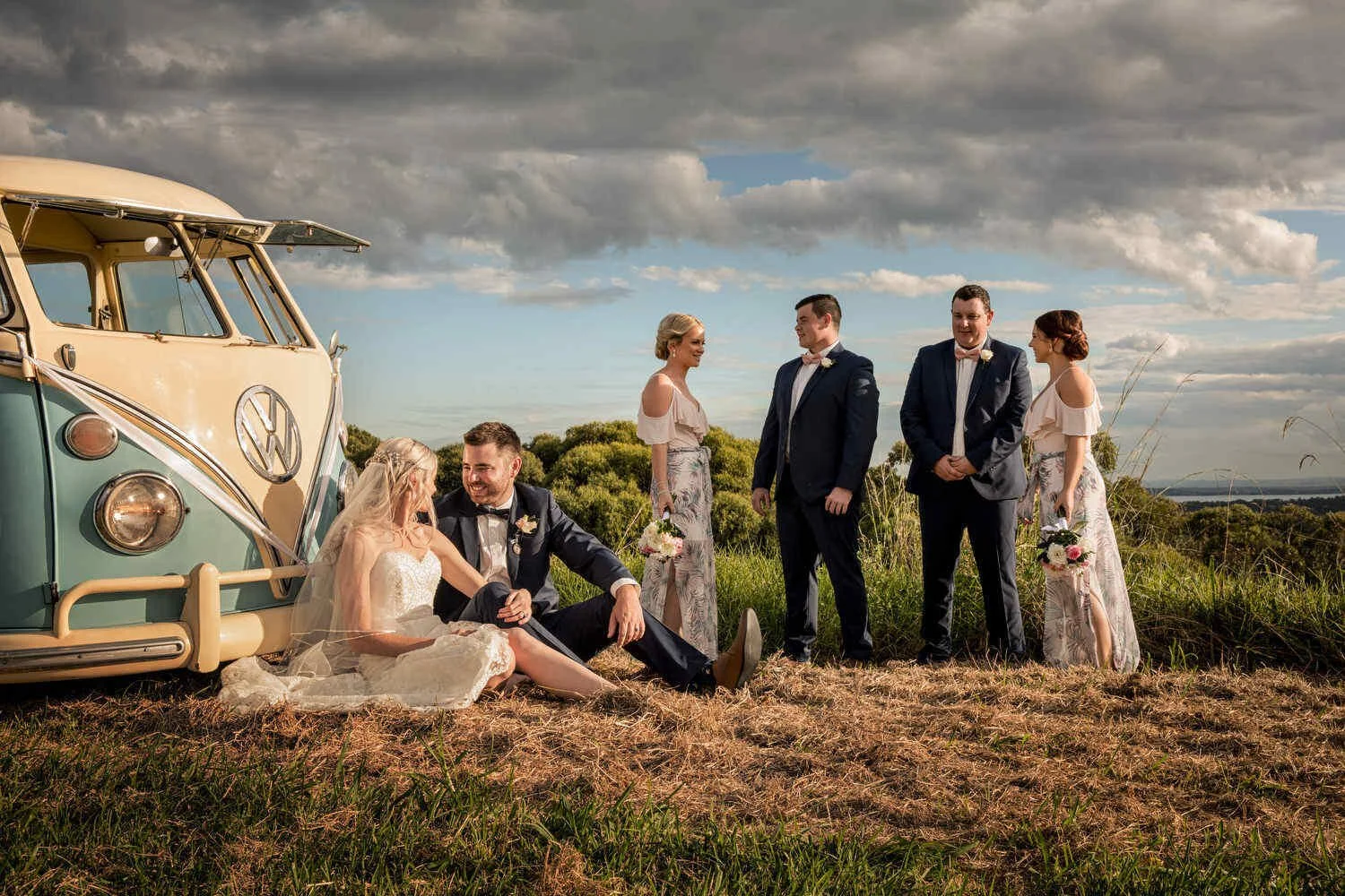 Wedding party outdoors with a vintage Volkswagen van