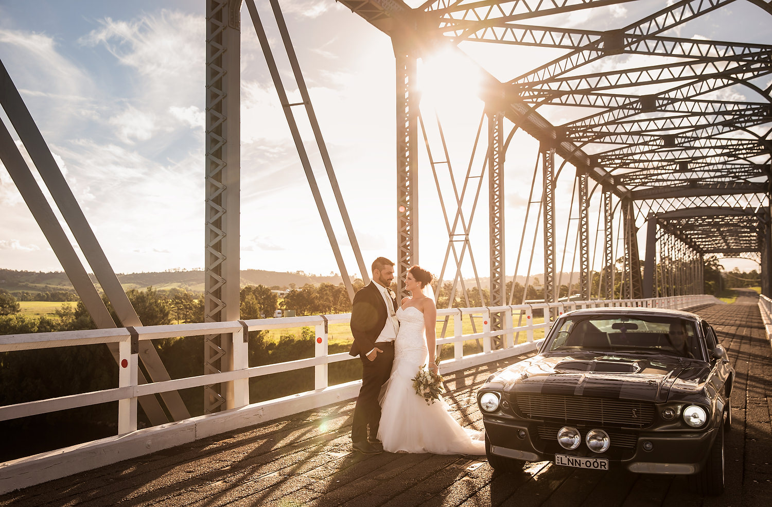 Calvin estate wedding photography on bridge with the sunset 