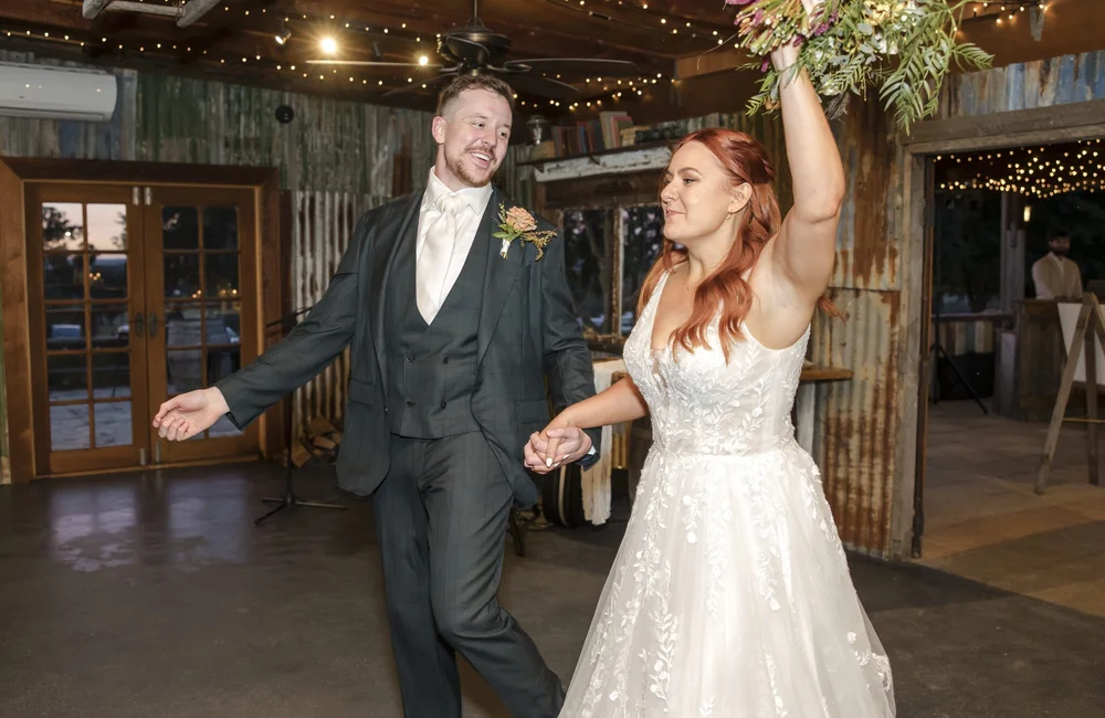Couple celebrating their entrance into the reception, Adams Peak Country Estate, Broke