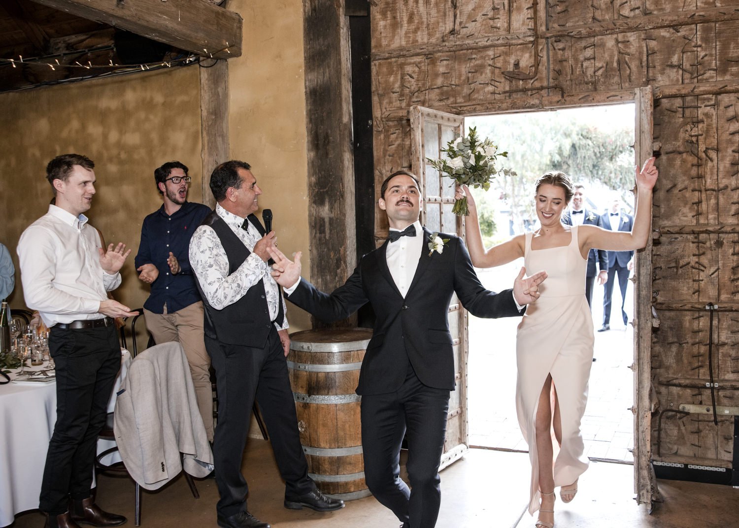 Bride and Groom dancing on entrance of Peppers Creek Barrel Room  