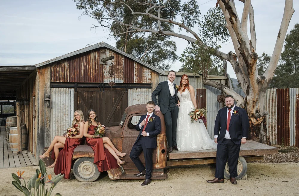 Bridal party with the vintage truck beside a rustic tin shed, Adams Peak Country Estate, Broke