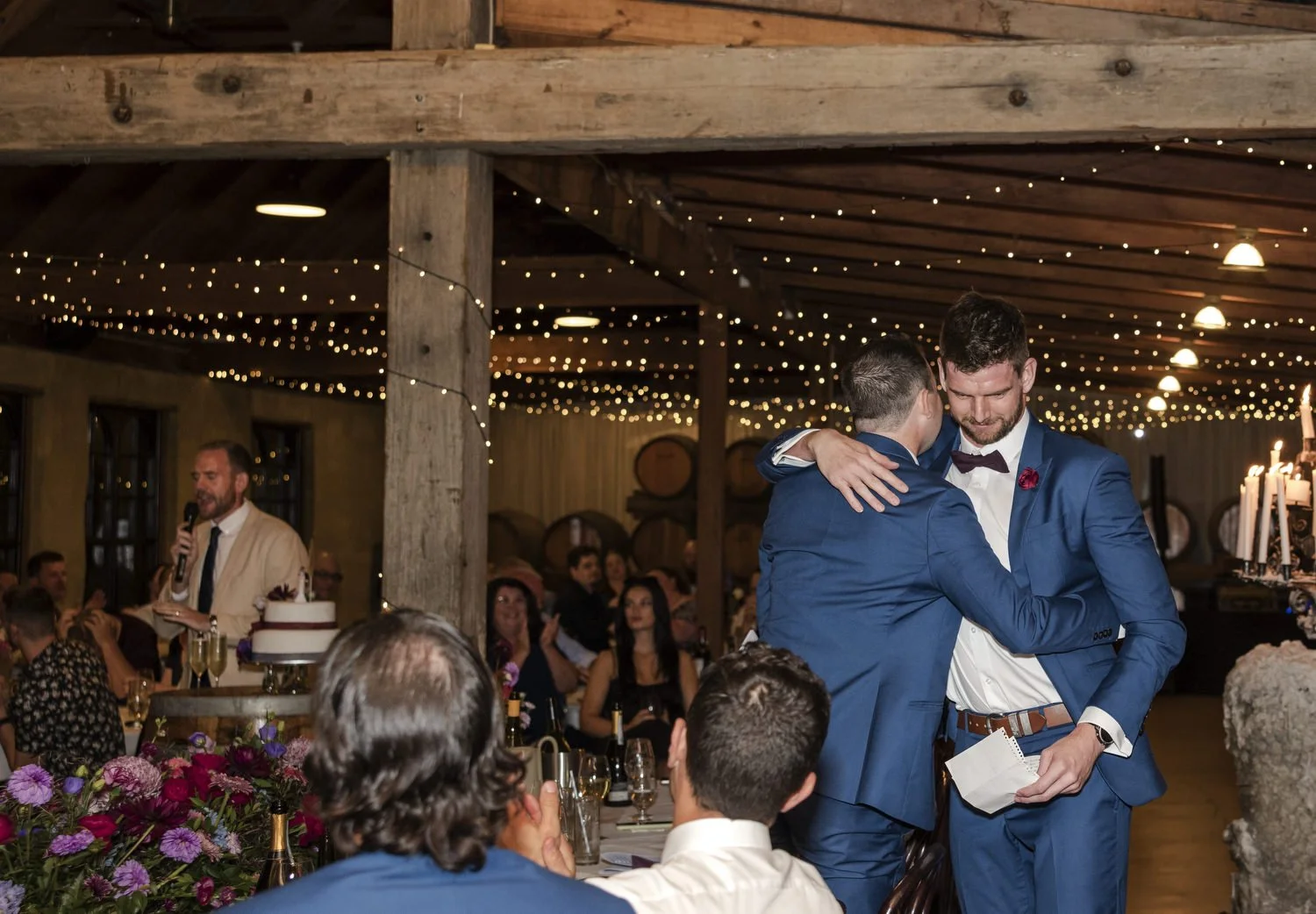 groom hugging groomsman at reception in the Hunter Valley 
