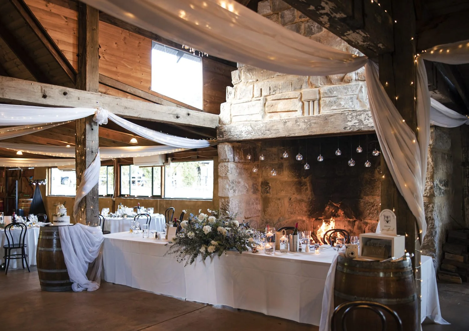 wedding Peppers Creek Barrel Room  Hunter Valley table setup with fireplace 