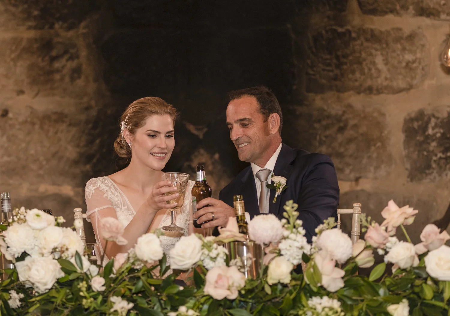 Bride and Groom cheesing at bridal table Peppers Creek Barrel Room  