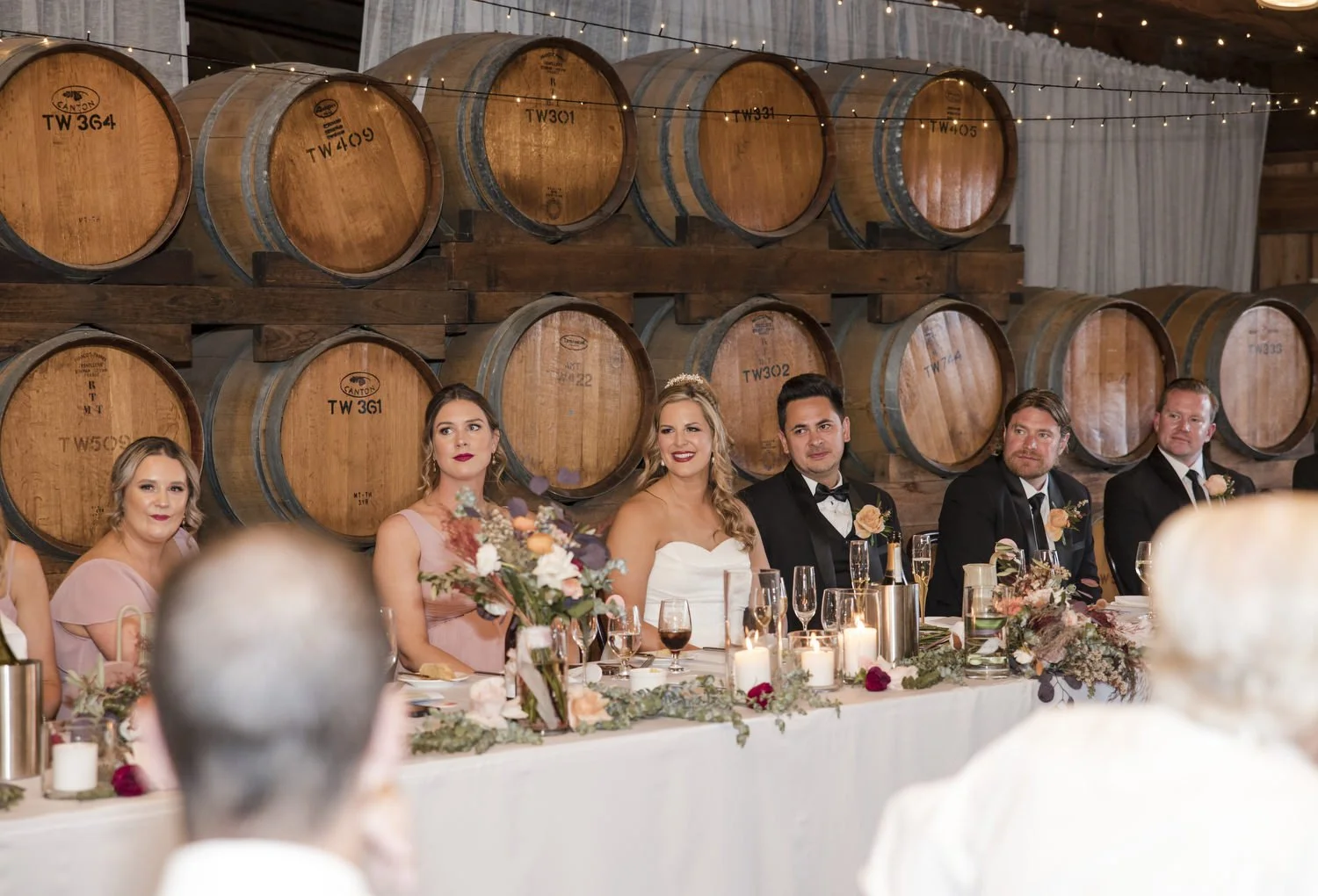 reception bridal party watching speeches at Peppers Creek Barrel Room  