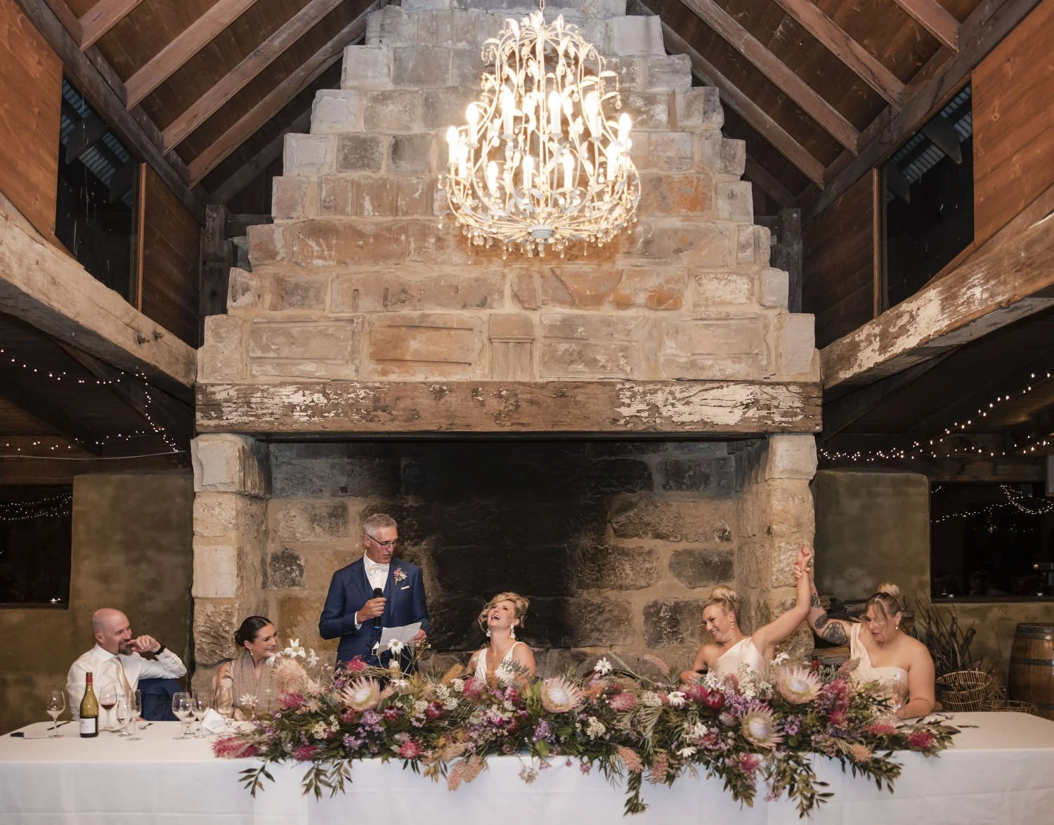 wedding reception at Peppers Creek Barrel Room  in front of fireplace