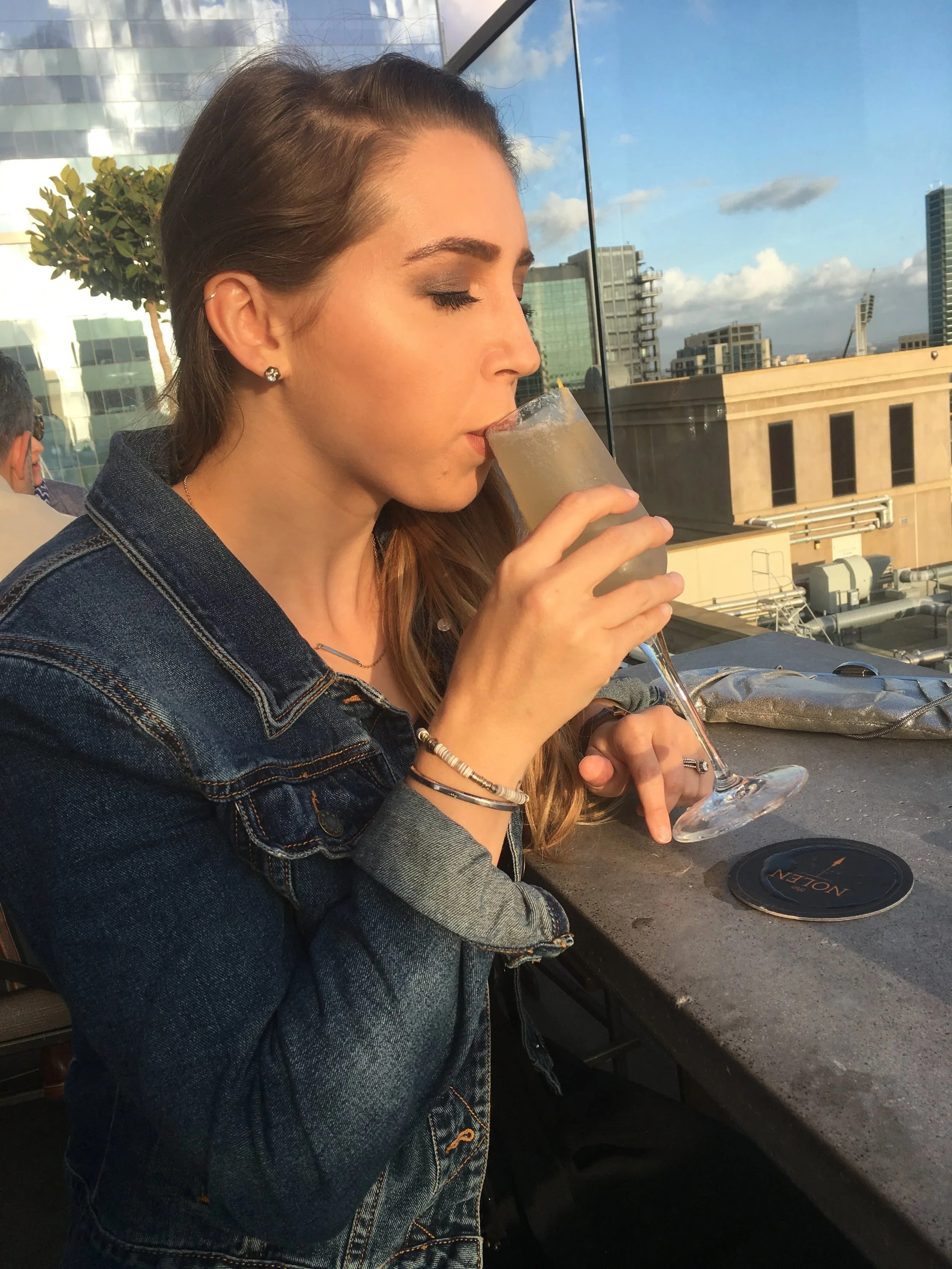 Sipping a champagne cocktail at the rooftop bar The Nolen