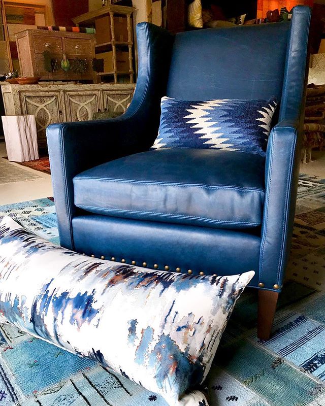 Meanwhile, back at the studio today,
a calming blue water leather club chair arrives for a clients living room. Our workroom churned out this painterly fabric bolster pillow for a bedroom install and a vintage kilim rug awaits a causal family room.
#