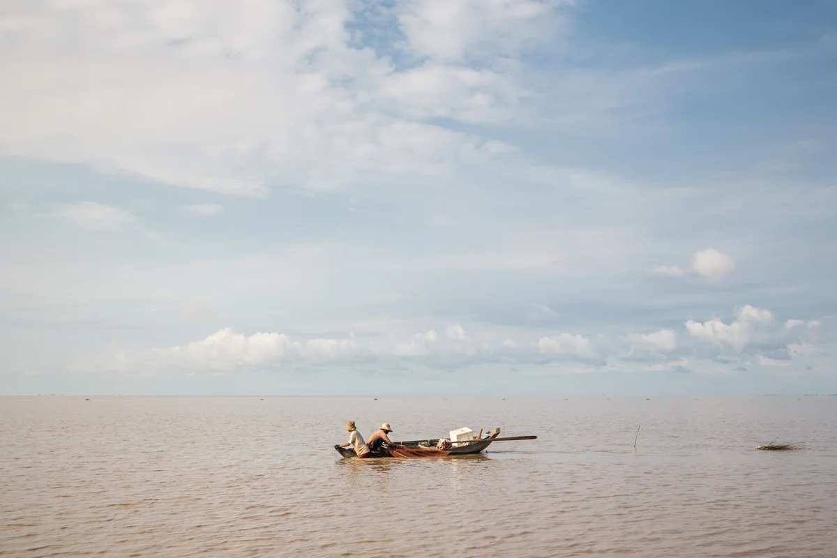 May 24, 2016 - Prek Toal, Cambodia. A couple fish on the Tonle Sap lake, the unusually low water levels on the lake means that the lake is often not much deeper than waist height. Tonle Sap lake listed as a Unesco biosphere reserve since 1997 the wetland supports the livelihoods of more than 1.2 million people and is a source of more than a third of all the protein eaten by Cambodia’s 15 million people. © Nicolas Axelrod / Ruom
