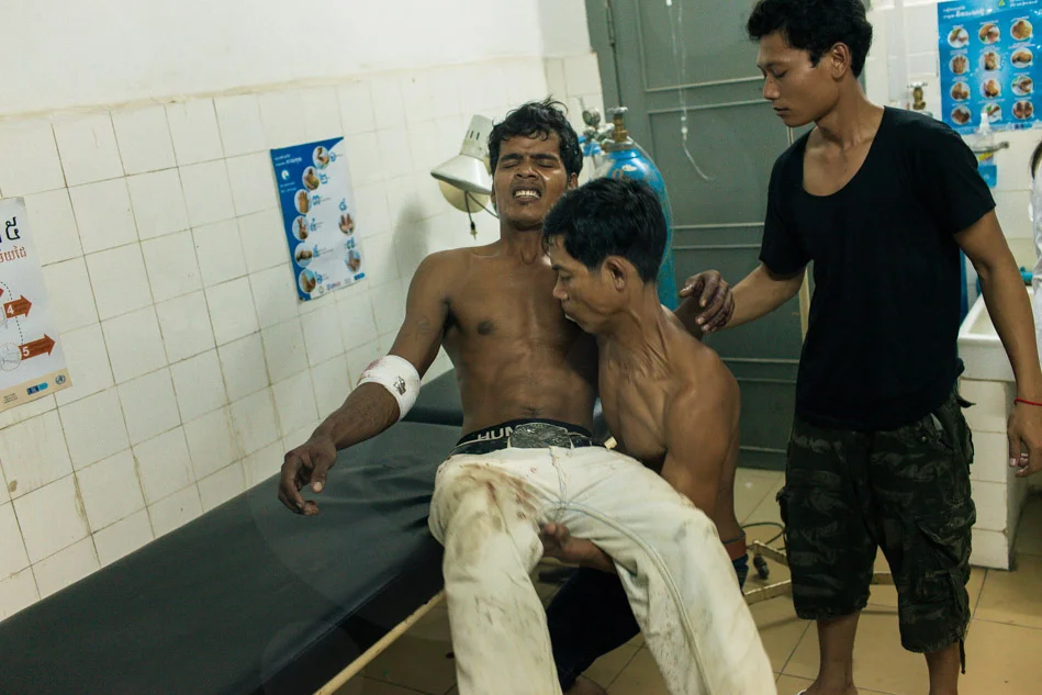 An injured man is brought to hospital after clashes erupt in Phnom Penh after commuters were barred from returning home. Angry protestors confronted riot police who responded with tear gas and live rounds. The leading opposition party, the CNRP, are holding three day mass demonstrations to contest the Cambodian general election results. Sept. 15, 2013. © Thomas Cristofoletti / Ruom