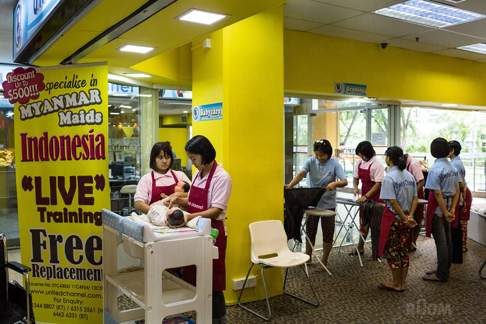 May 12, 2014 - Singapore. Maid agency with domestic workers on display at Katong shopping centre. © Nicolas Axelrod / Ruom