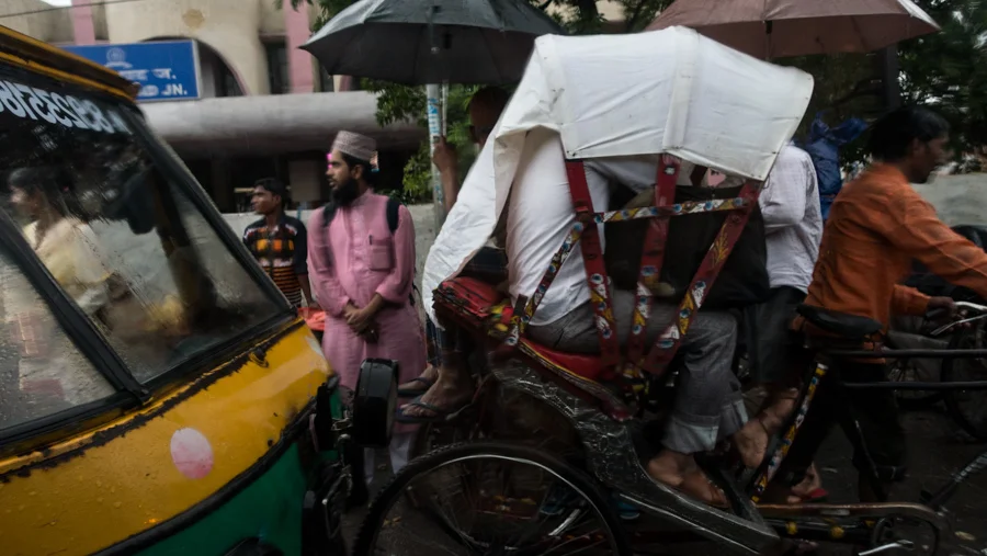July 18, 2016 - Moradabad, India. People out in the rain, photographed from a passing car. © Nicolas Axelrod / Ruom