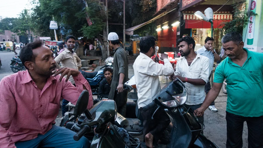 July 18, 2016 - Moradabad, India. Repairing motorcycles out the front of a shopping complex. © Nicolas Axelrod / Ruom