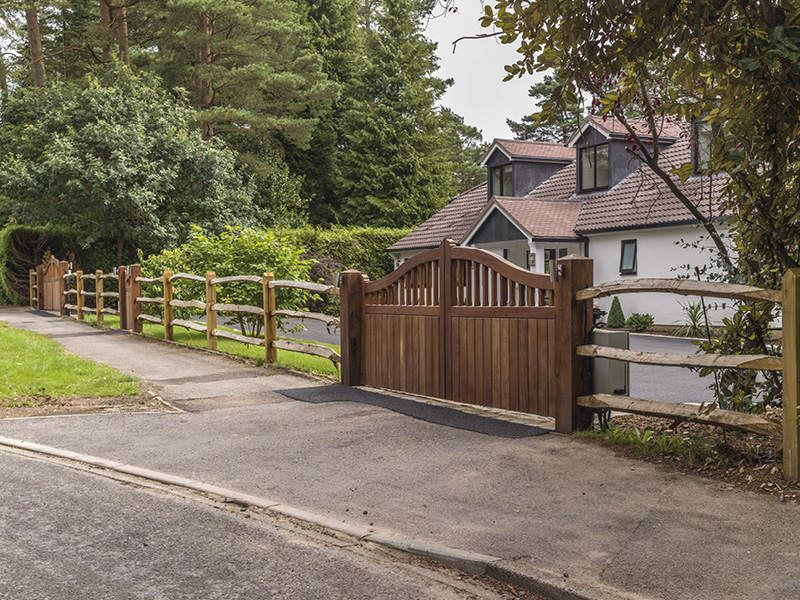 Automated gates and open fencing create a pleasing entrance to this property