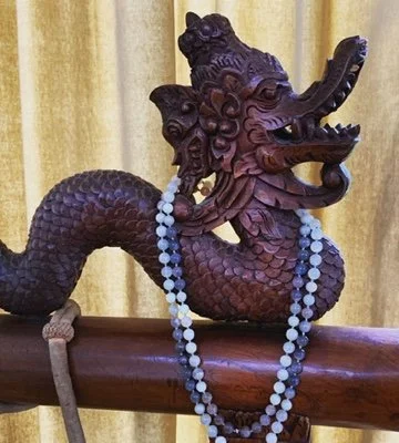 The carved dragon on one of my gong stands