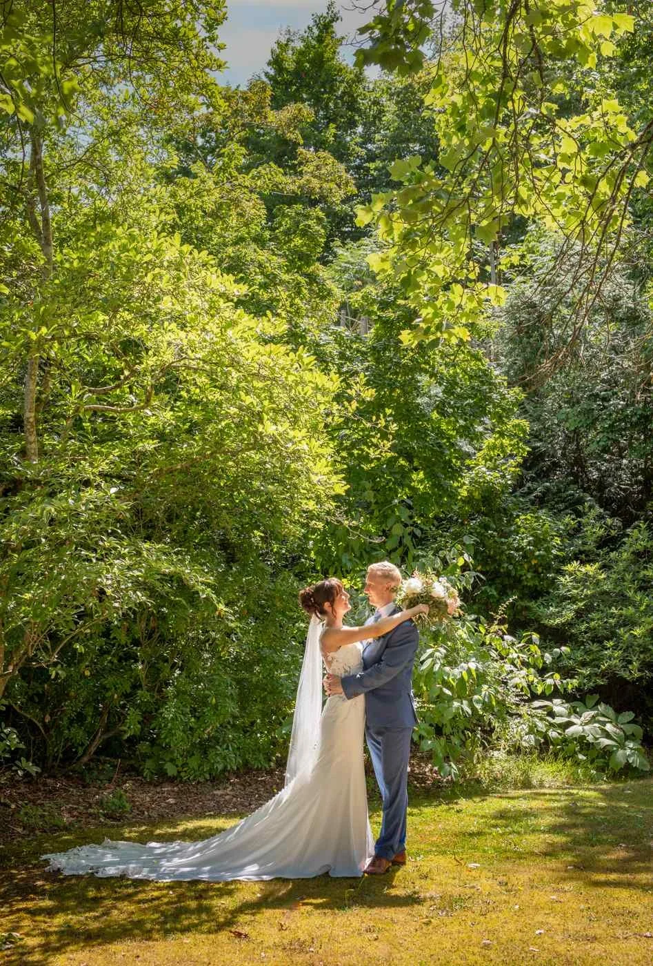 bride and groom embracing in the new forest