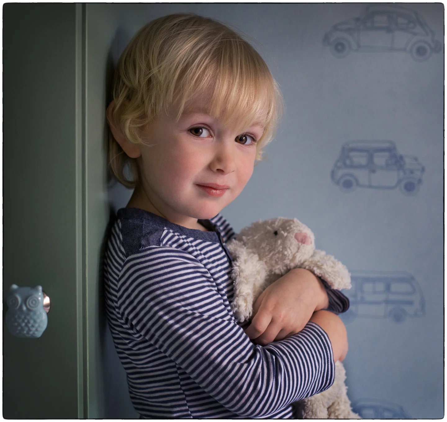 portrait of young boy with teddy bear