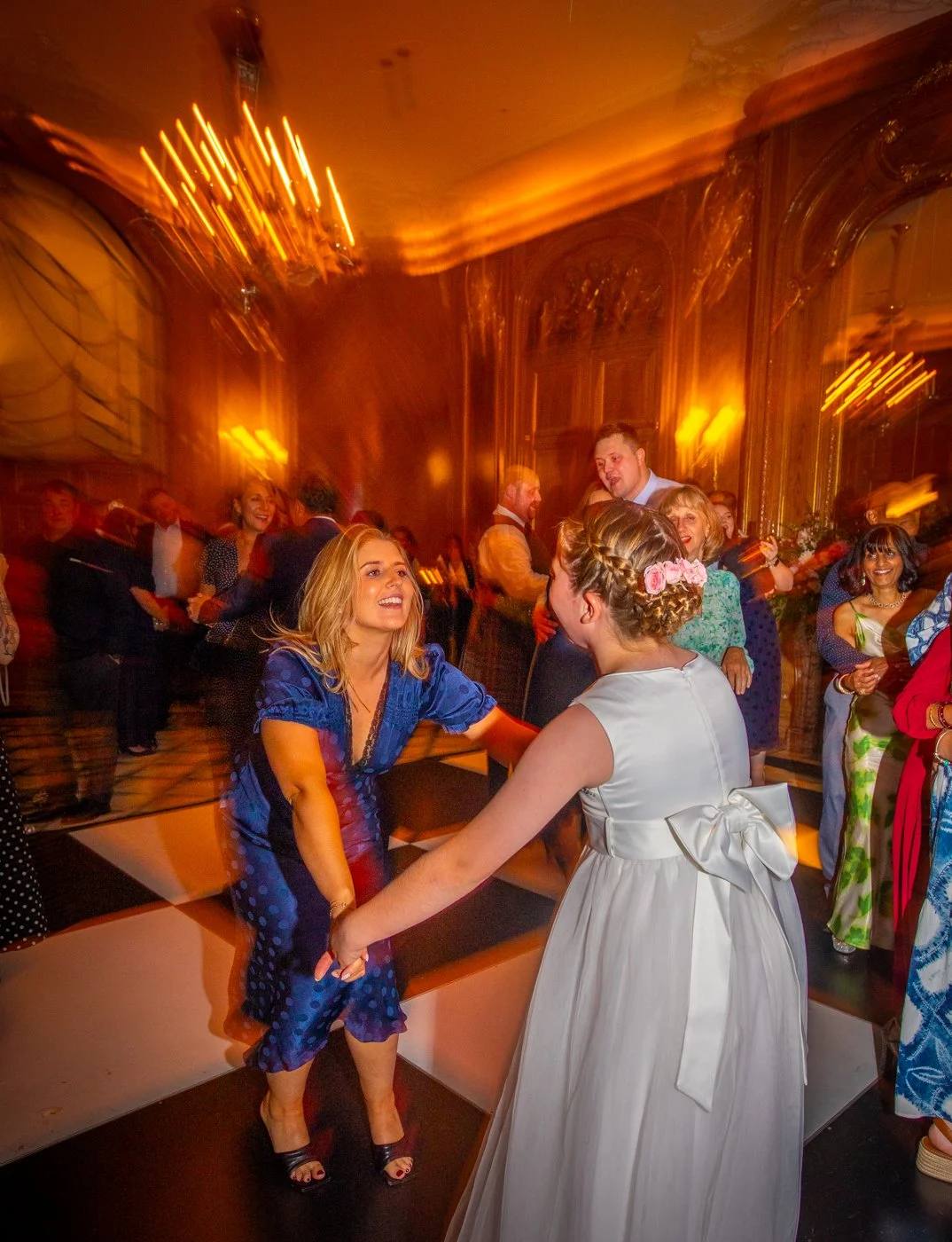 wedding-photograph-claridges-bridesmaid-bride-dancing.jpg