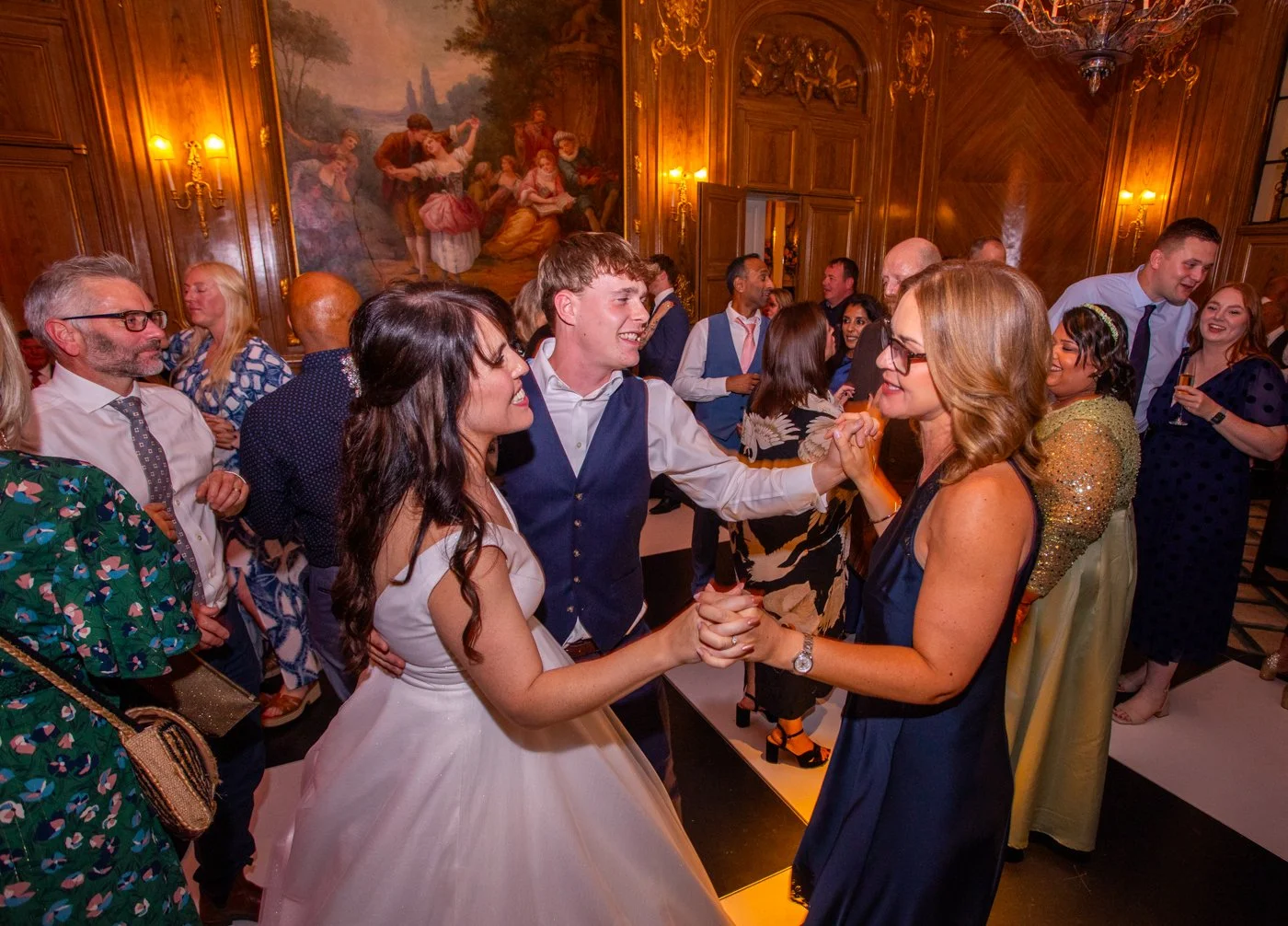 wedding-photograph-claridges-bride-son-guest-dancing.jpg
