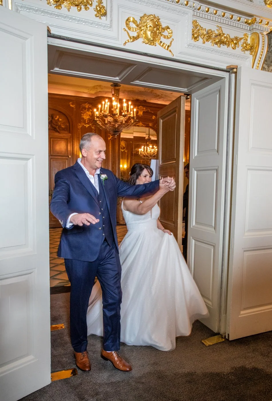 wedding-photograph-claridges-reception-entrance-grand-reveal.jpg