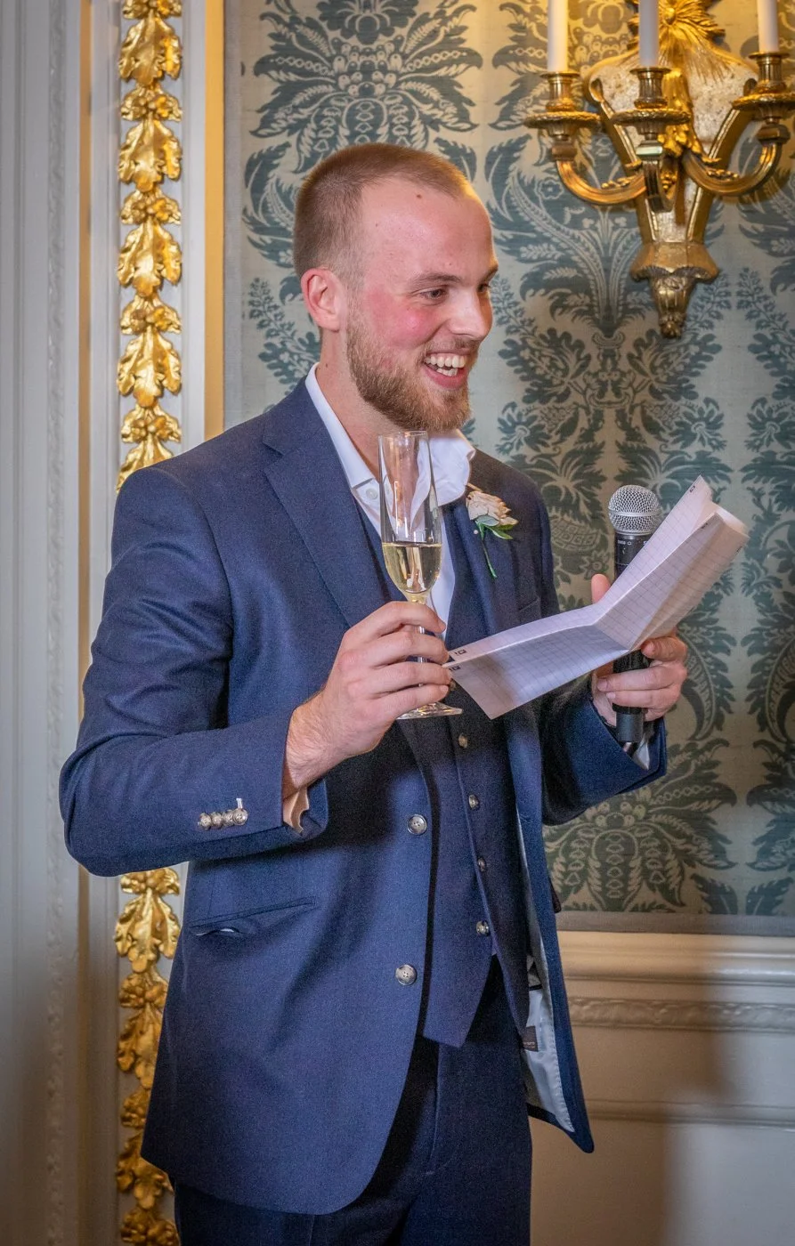 wedding-photograph-claridges-groomsman-speech-champagne.jpg