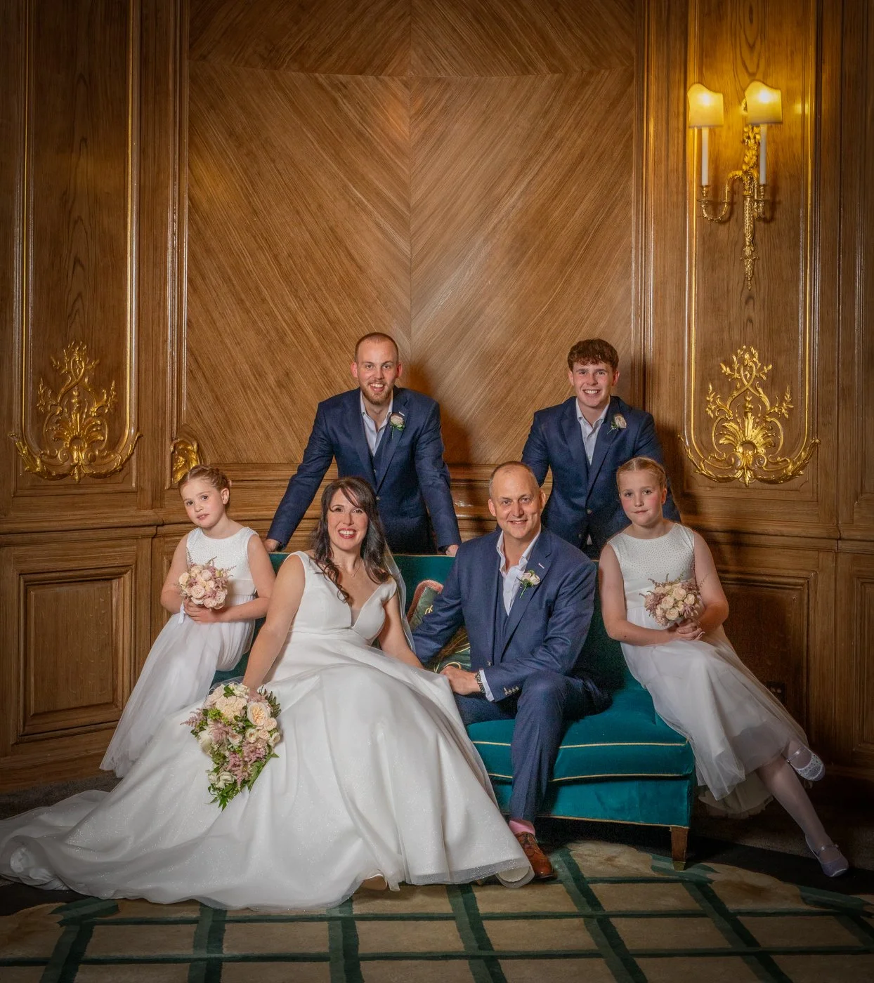 wedding-photograph-claridges-family-group-portrait-wood-paneling.jpg