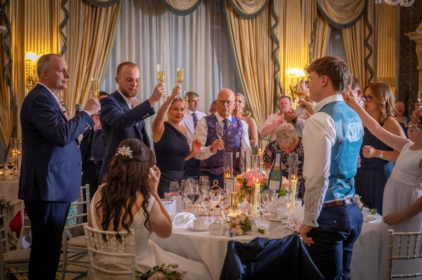 wedding-photograph-claridges-champagne-toast-celebration.jpg