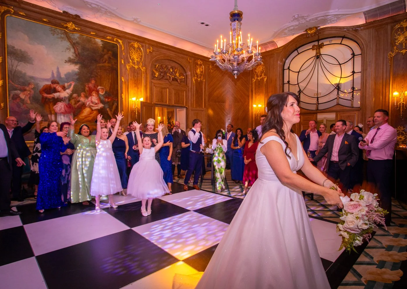 wedding-photograph-claridges-bouquet-toss-dance-floor.jpg